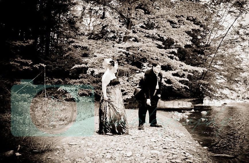 Bride and groom skipping rocks