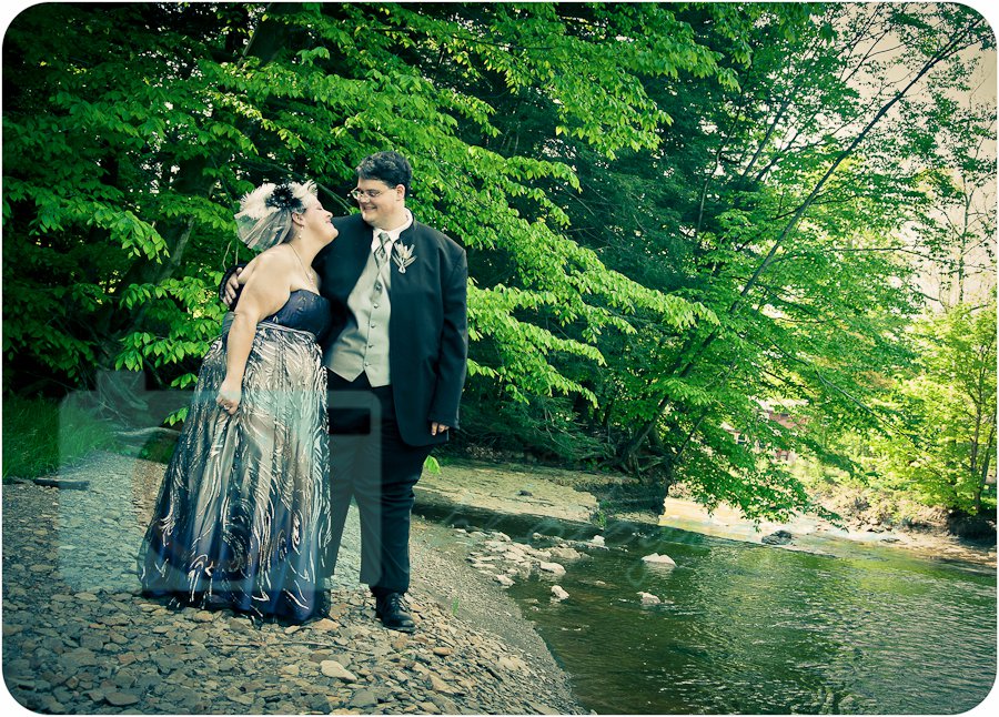 Bride and grrom by river