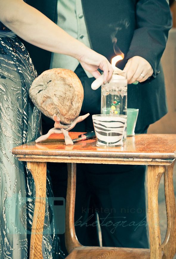 bride and groom lighting unity candle