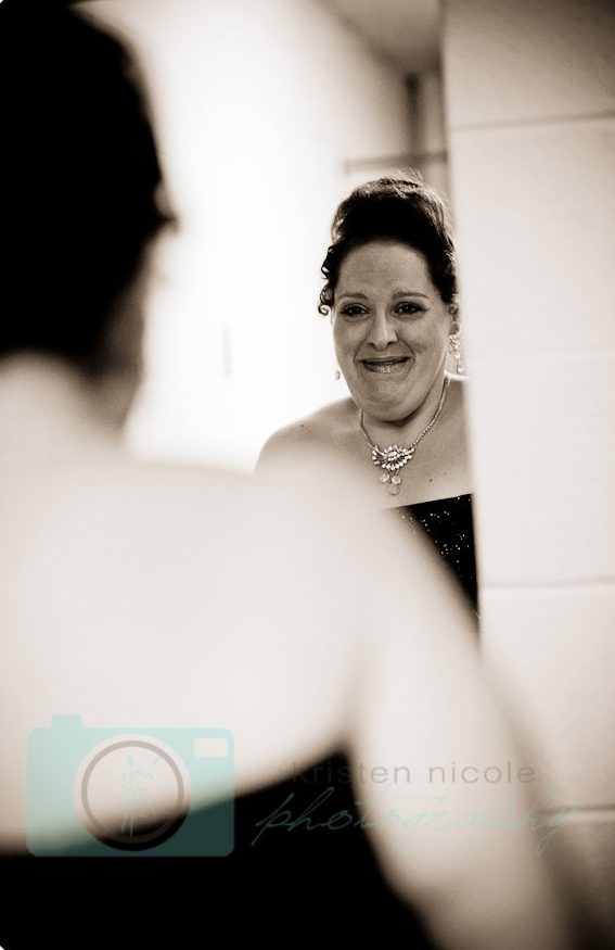 bride looking into mirror