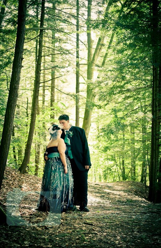 bride and groom in woods cleveland wedding planner