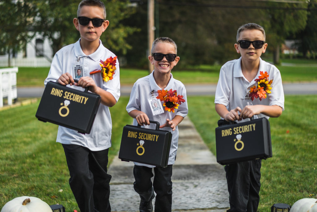 Ring bearers carring ring suitcases