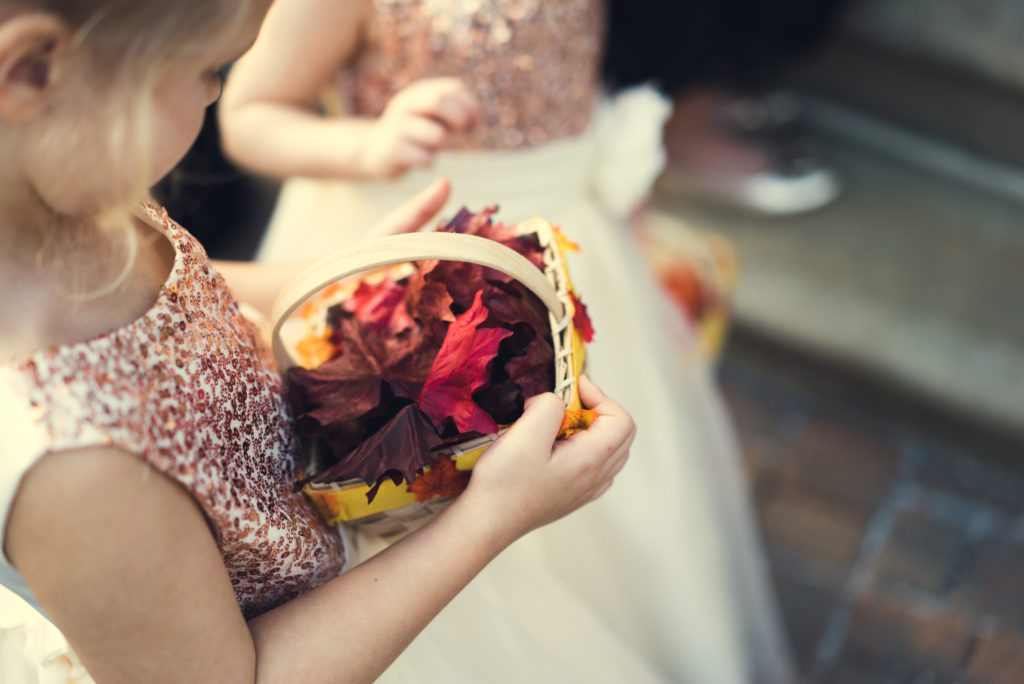 flowergirl throwing leaves