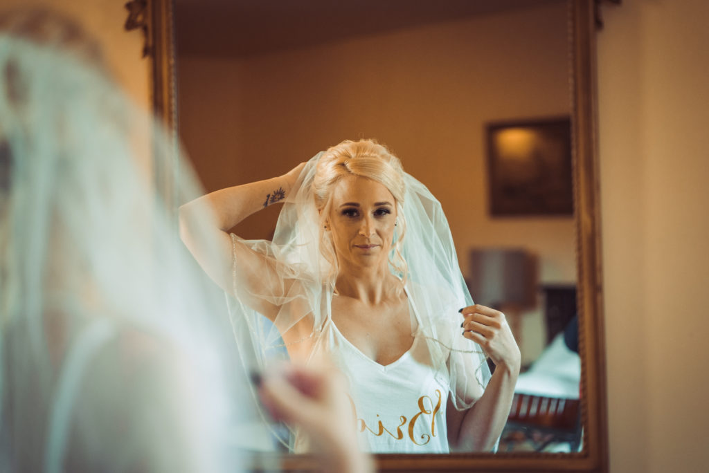 bride looking in mirror