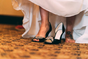 bride putting on shoes