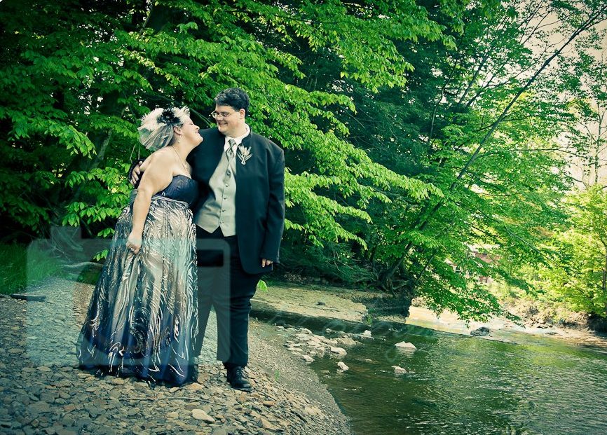 Bride and grrom by river