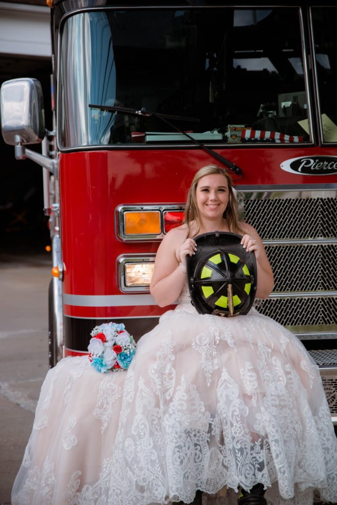 Cleveland wedding planner bride on firetruck