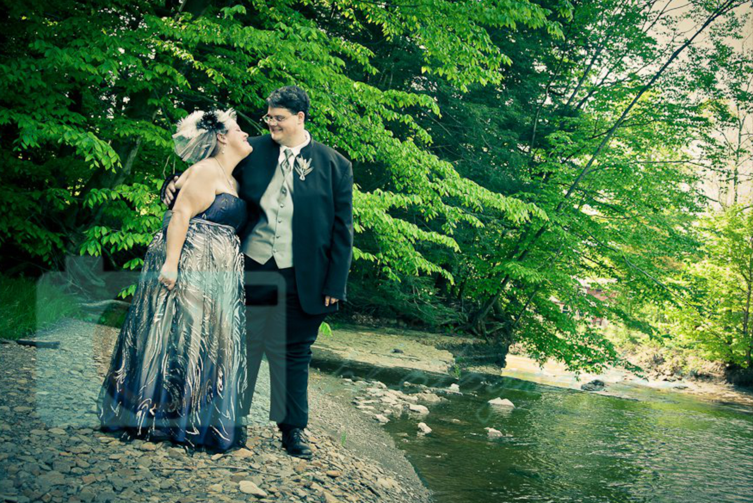Bride and grrom by river